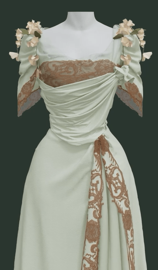 A close up of the front of a 3 dimensional rendering of the Worth Dress, showing its separate mint green skirt and bodice with surface decorations of cotton lace and morning glory flowers. The neckline features silk netting and three-inch wide lace with an irregular edge. The lace is also doubled on the bodice to create a wider effect.
