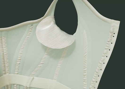 A close up of the right side of a 3 dimensional rendering of the Worth Dress’ bodice interior showing its removable interior underarm pad.
