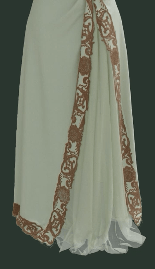 Close up on the bottom front and side of a 3 dimensional rendering of the Worth Dress, showing its separate mint green skirt with surface decorations of cotton lace.