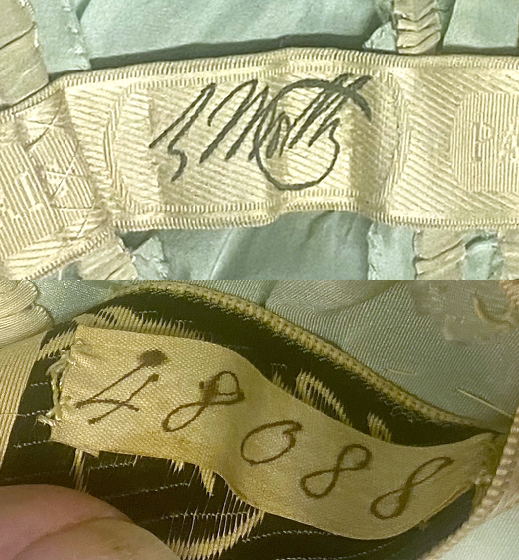 A close-up of the brand label on the interior of a dress shows the signature of Worth while the underside of the label shows the number 48088.