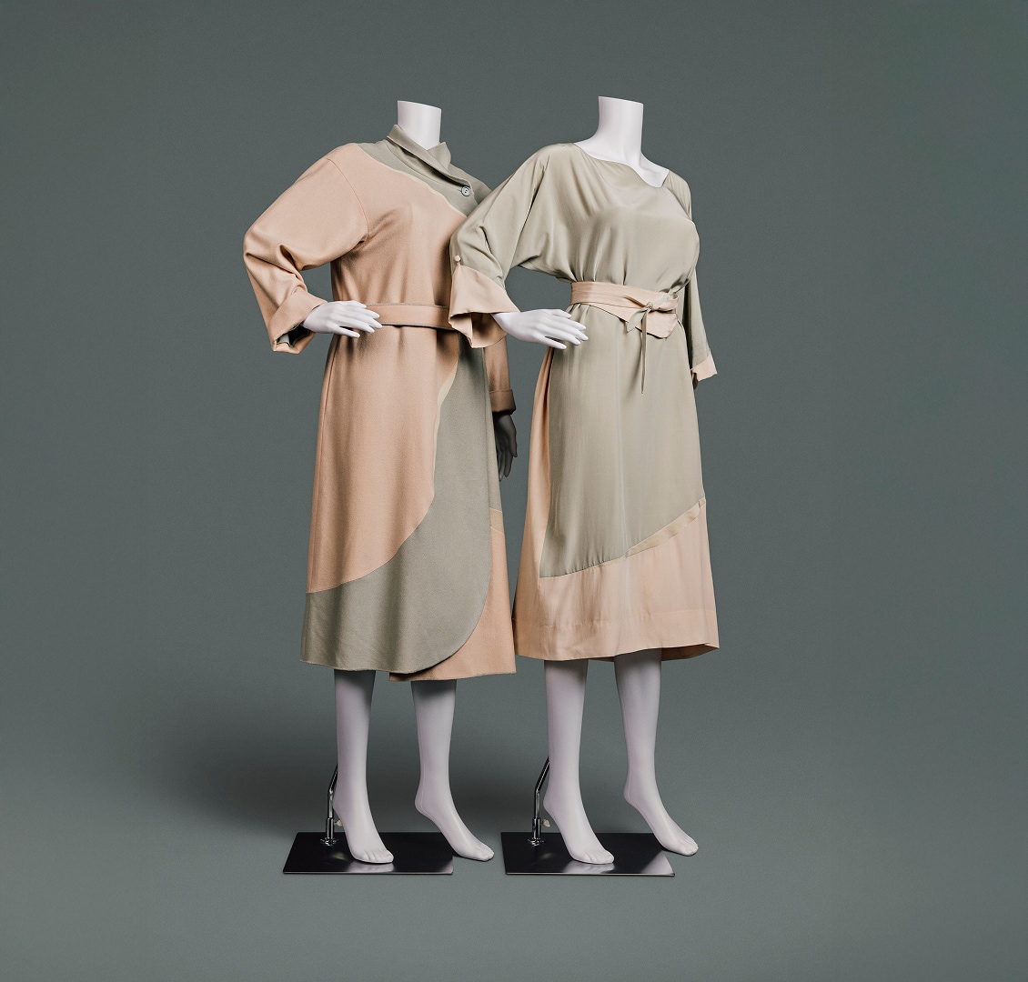 Loose-fitting silk and wool two-coloured dress and jacket. Each is designed with curved shapes where peach- and khaki-coloured fabrics meet.
