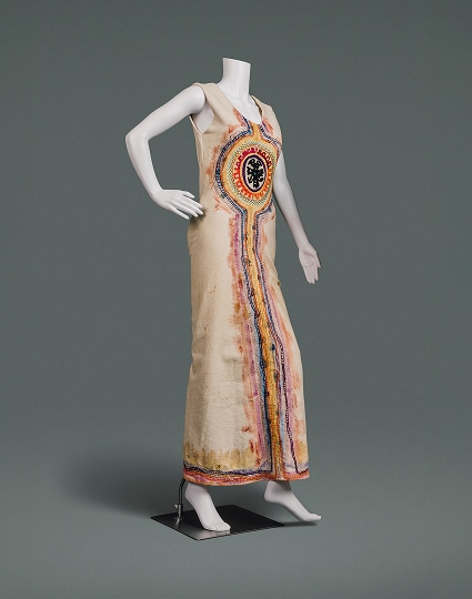 A full-length natural cotton shift decorated with painting and embroidery influenced by folk art traditions.