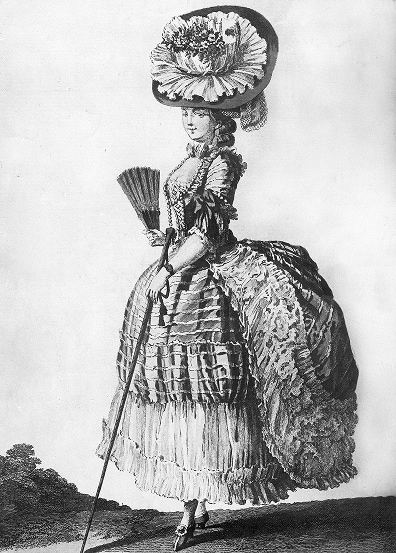 A woman in Rococo fashion stands on a hillside holding a fan and delicate walking stick.