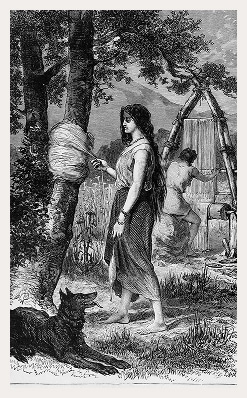 An Indigenous woman winds fibres around the trunk of a tree while a man weaves threads using a rudimentary loom in the background. A dog sits peacefully in the foreground.