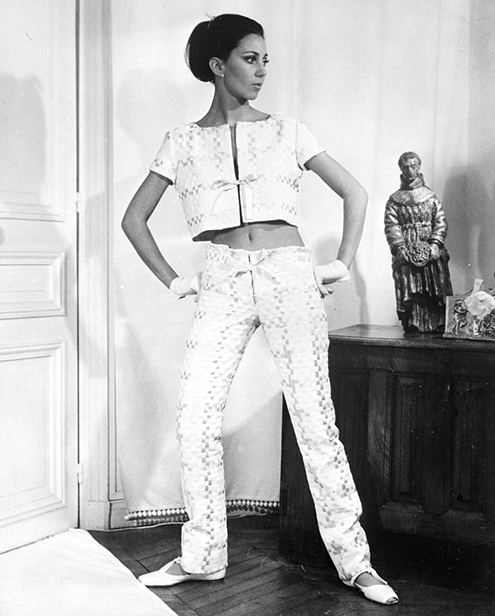 Model posing in short satin top and pants.