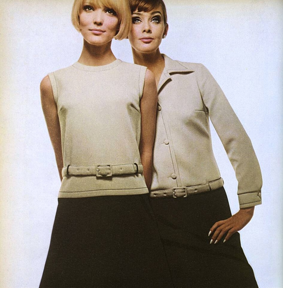 Two short-haired models pose in coordinated outfits.