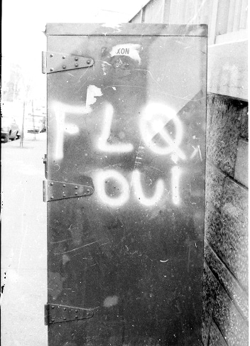 A Canada Post drop box with graffiti that reads “FLQ oui”