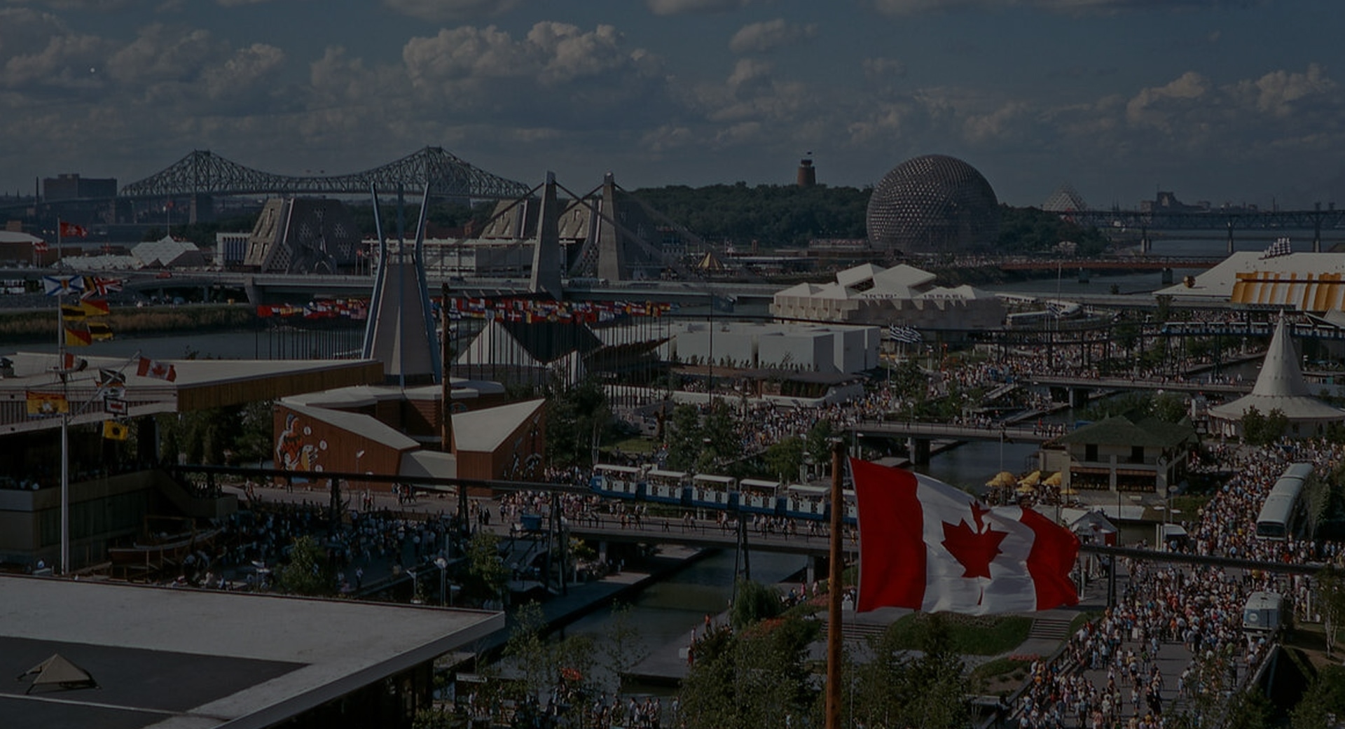 Pavilions of Expo 67 Montreal Canada with Jacques Cartier Bridge in the distance.
